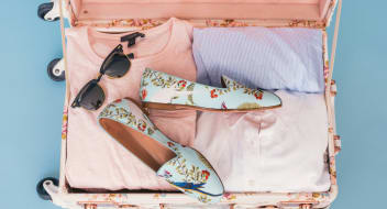 Pink suitcase ready for vacation